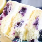 Lemon Blueberry Cake topped with blueberries and lemon zest